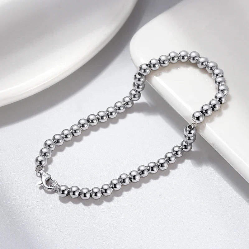 Minimalist 925 sterling silver bead chain bracelet with round polished beads, rhodium plated for lasting shine and tarnish resistance