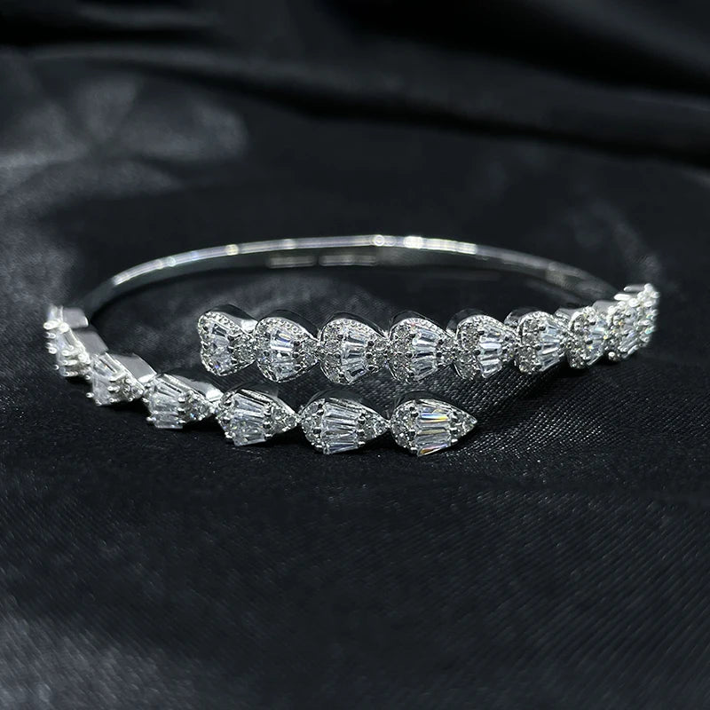 Elegant silver zircon teardrop bangle bracelet in 925 sterling silver on black background