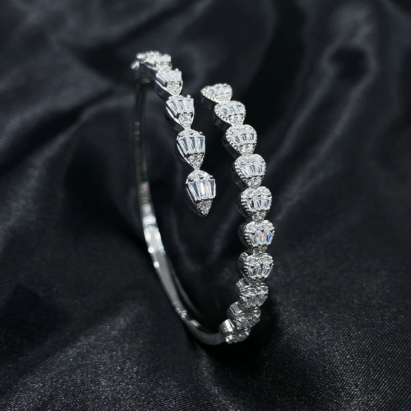 Detailed close-up of zircon stones set in 925 silver teardrop bracelet, angled view