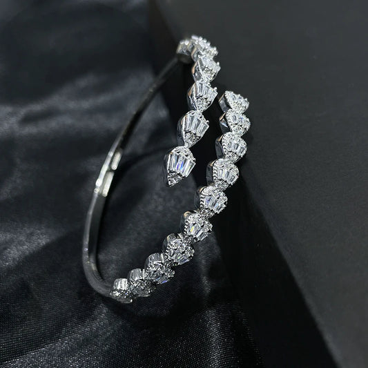 Side view of 925 sterling silver bracelet with teardrop zircon stones, luxury design