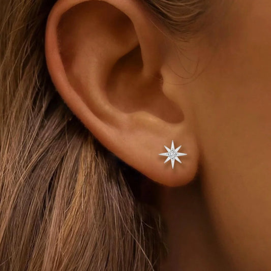 North Star stud earring with zircon shown on model’s ear, minimalist silver jewelry look