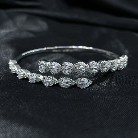 Elegant silver zircon teardrop bangle bracelet in 925 sterling silver on black background