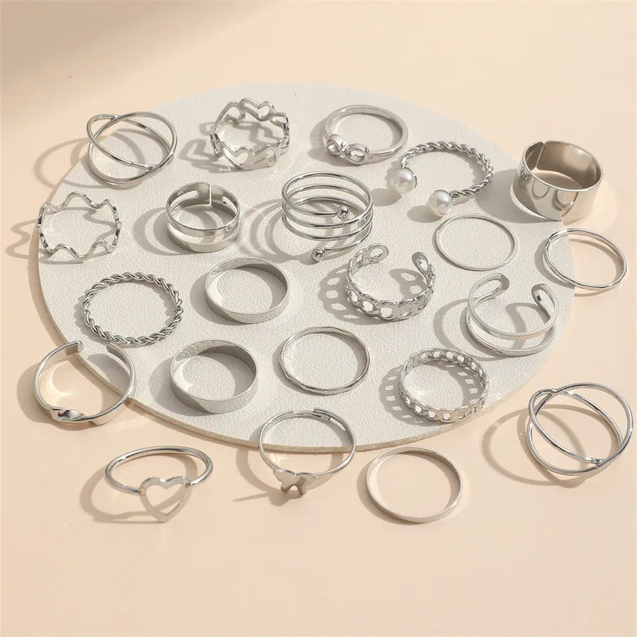 Assorted silver-tone rings for women with retro patterns and pearls